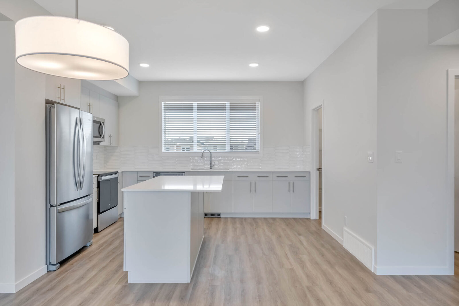 Kitchen with island and pendant lighting