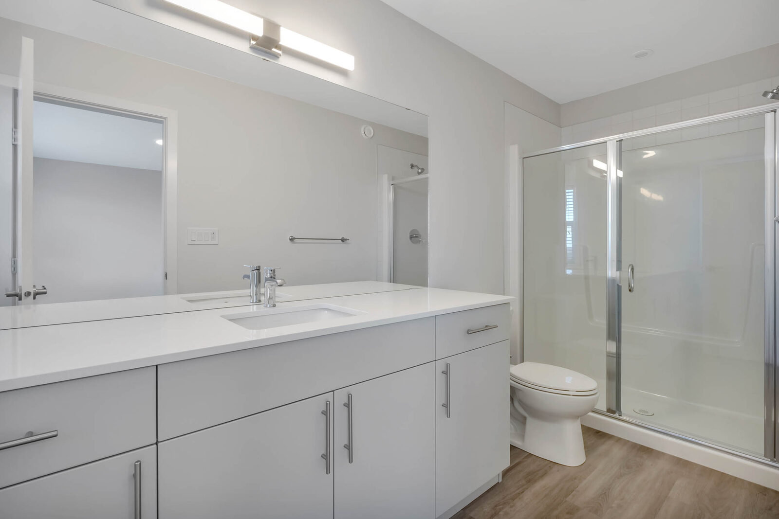 Ensuite bathroom with double vanity and shower