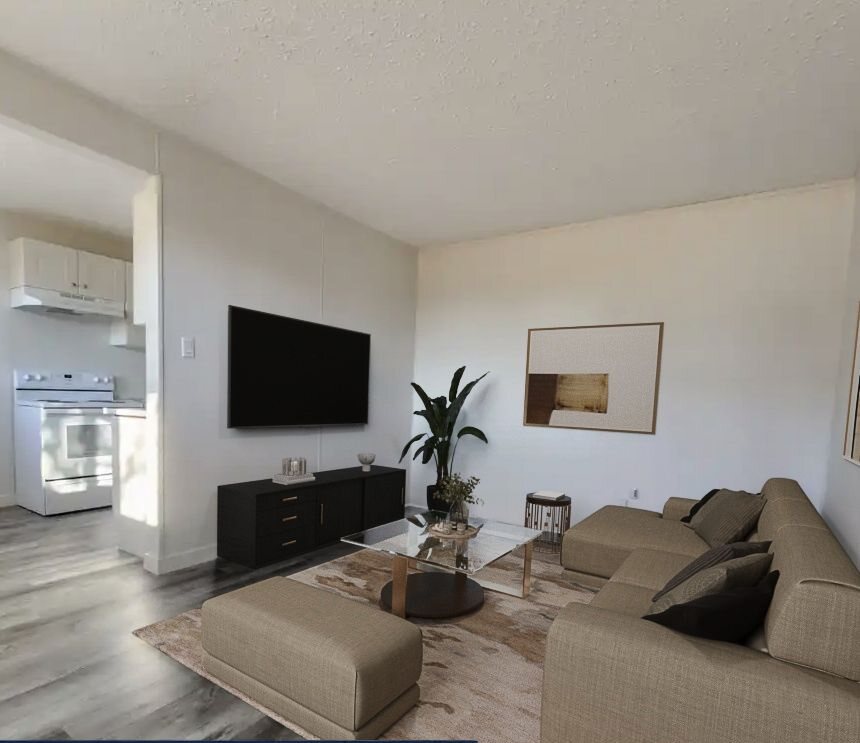 Living area, virtually staged with sofa and rug